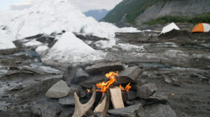 fire on the ice while camping on a glacier