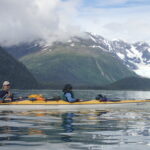 people sea kayaking in Alaska