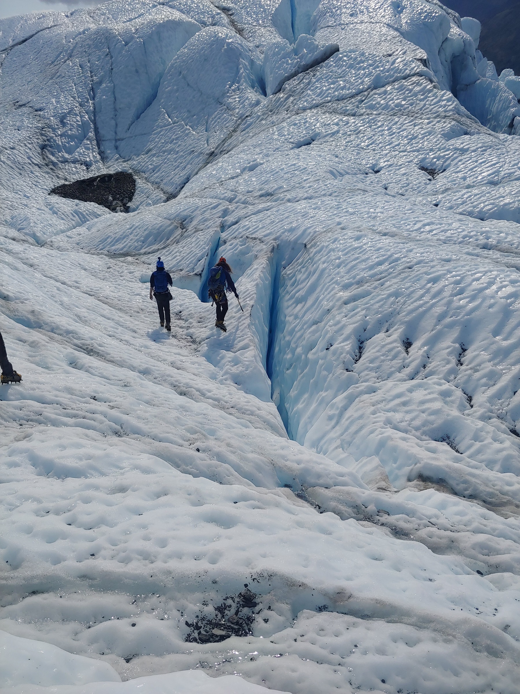 people walking on glacier