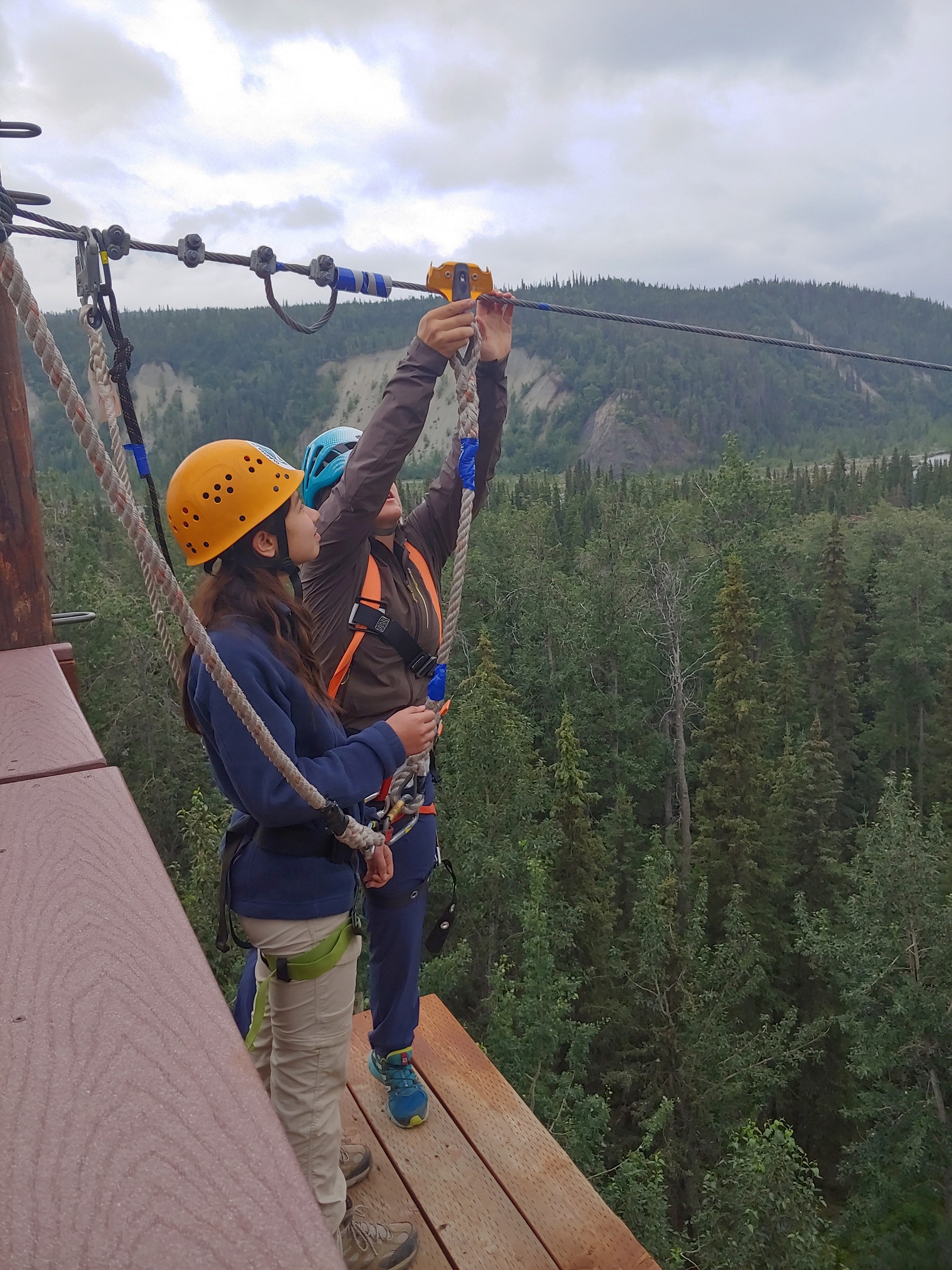 people ziplining along Glenn Highway