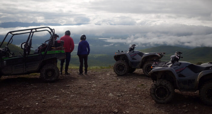 ATV and UTV at top of mountain pass in Alaska