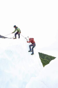 a climber tops out at a rope station on the Matanuska Glacier