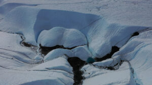 meltwater and moraine moving down glacier