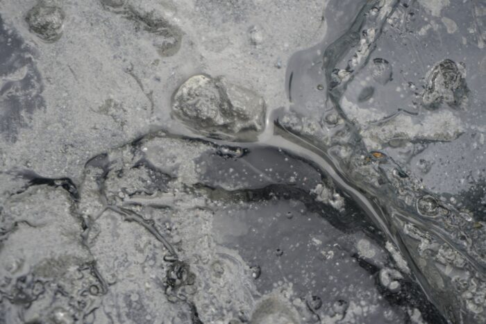 grey silt and ice on glacier