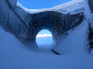 blue ice cave on Alaska glacier in winter