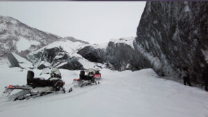 snowmobiles on Matanuska overcast day